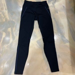 Hyba black sport leggings with mustard, blue and white stripes.